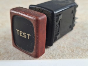 Klawisz, przycisk, włącznik deski rozdzielczej autobusu RENAULT FR1, symbol TEST